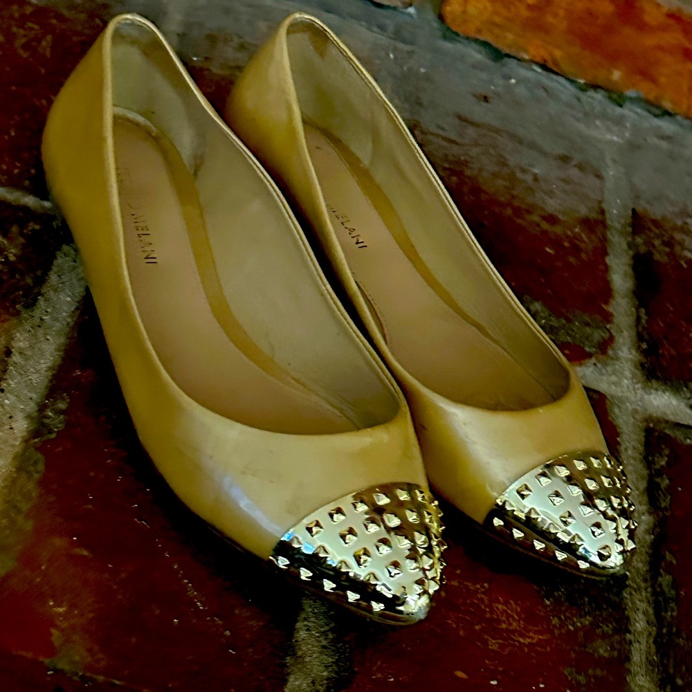 Stylish patent flats with gold tipped toes